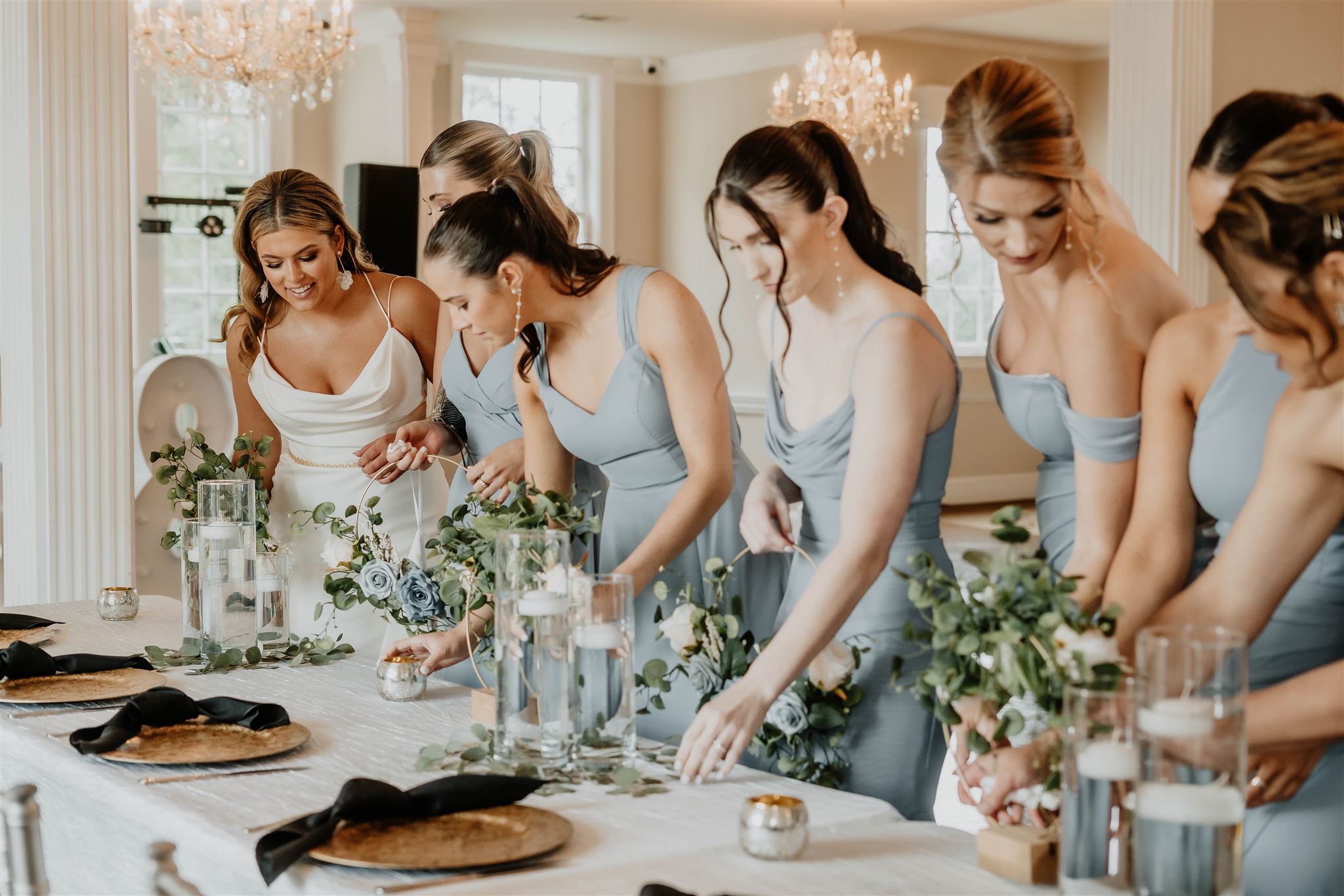 Bride and her bridesmaids enjoying the details of the reception at Separk Mansion in Gastonia, NC photographed by Christina of The Shutter Owl Photography