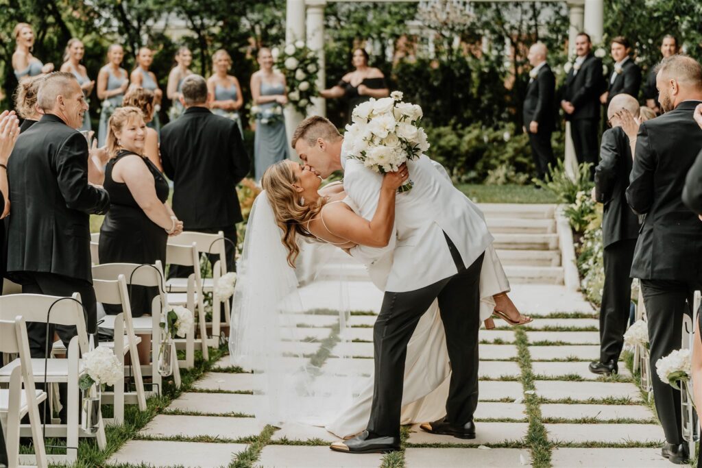 Dip kiss and exit in ceremony space at Separk Mansion in Gastonia, NC by Christina Elmore of The Shutter Owl Photography
